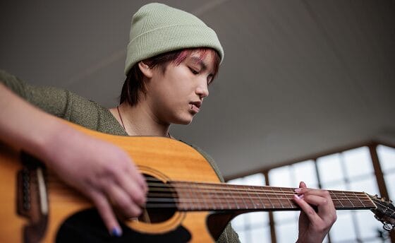 boy playing guittar